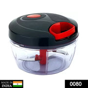 Compact manual food chopper demonstrating its pull-cord mechanism for chopping vegetables.