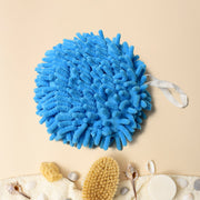 Microfiber hand towel with loop, conveniently hanging on a kitchen faucet.