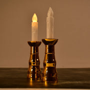 A pair of decorative flameless LED candle lights creating a warm ambiance.