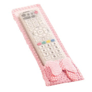 Display of dust-resistant remote control covers with bow knots, perfect for TV, AC, and DTH remote controls.