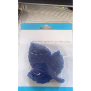 An overhead view of the CrystalWash leaf-shaped bath mat in a shower, showcasing its non-slip texture.