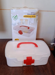 The First Aid Box filled with essential medical supplies like bandages and small bottles.