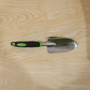 Garden tool in use for planting in flower bed