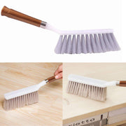 Sturdy household cleaning brush with a long handle, suitable for floors and various surfaces.